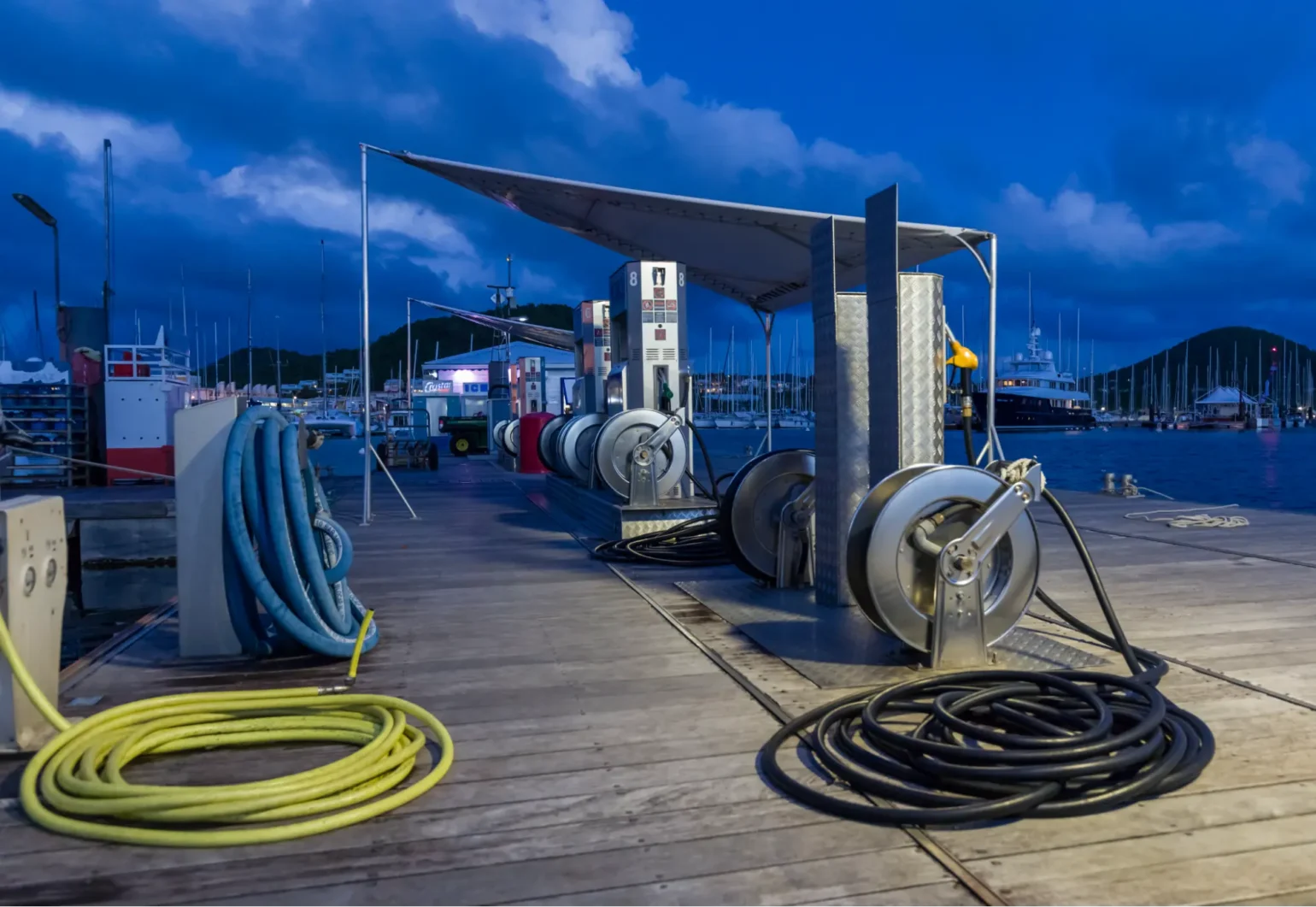 Marine fuel pumps at dusk, in a marina